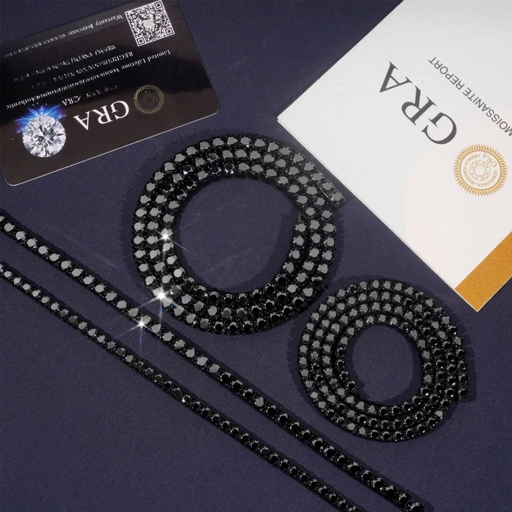 Black gunmetal tennis chain laid flat, showing the full continuous line of 4mm black moissanite stones