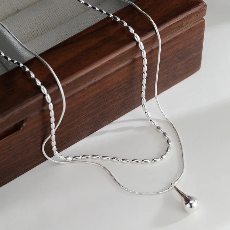 double-layered drop pendant necklace, silver-tone finish